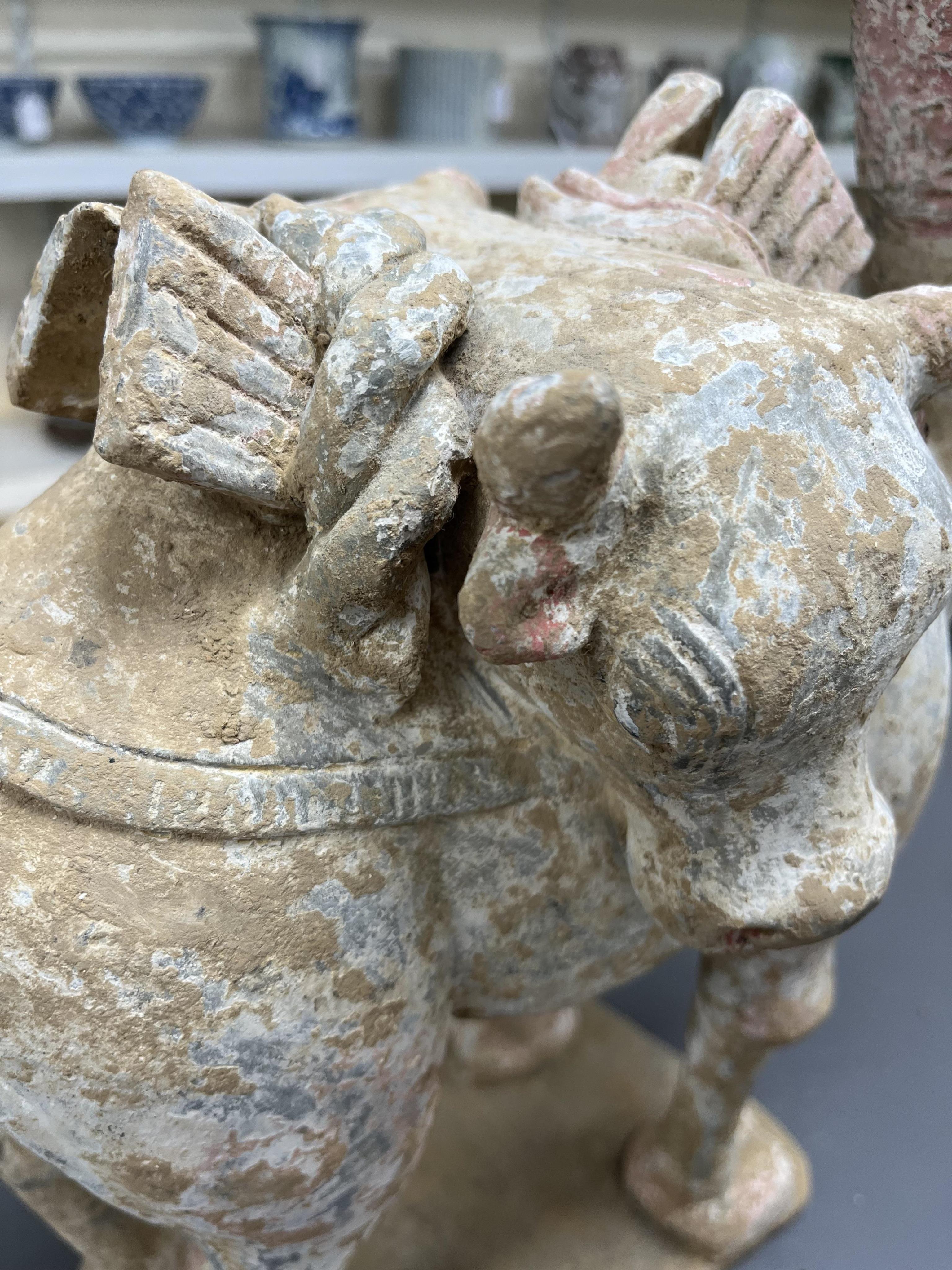 A Chinese pottery tomb figure of a Bactrian camel, Tang dynasty or later